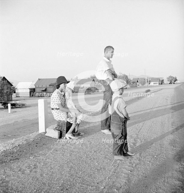Oklahoma farm family on highway between Blythe and Indio - self-resettlement in California, 1936. Creator: Dorothea Lange.