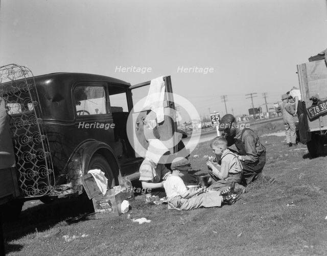Oklahomans bound for Oregon along a highway in California, 1937. Creator: Dorothea Lange.