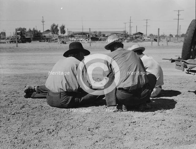 Oklahomans now working or looking for work in the pea harvests of California, Imperial Vallery, 1937 Creator: Dorothea Lange.