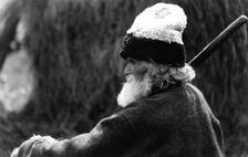 Old man wearing a woolly hat, Bistrita Valley, Moldavia, north-east Romania, c1920-c1945. Artist: Adolph Chevalier