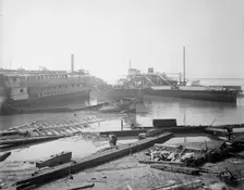 Old boats beached to rot away, New York City, between 1900 and 1910. Creator: Unknown