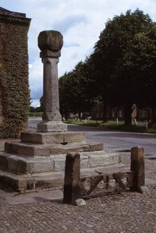 Old cross and stocks in village market square, Ripley, Yorkshire, 20th century. Artist: CM Dixon