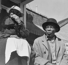 Old friends sitting on the front porch, Daytona Beach, Florida, 1943. Creator: Gordon Parks