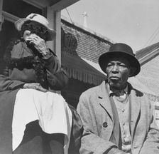 Old friends sitting on the front porch, Daytona Beach, Florida, 1943. Creator: Gordon Parks