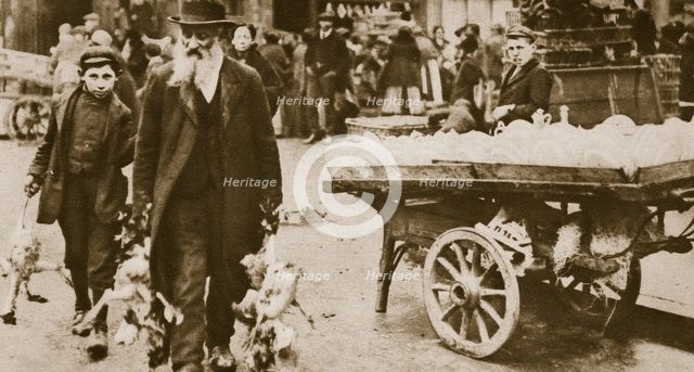 Old Jewish man and his grandson carrying some fowls, Wentworth Street, Stepney, 20th century. Artist: Unknown