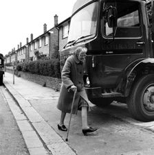 Old woman and truck on a London street, 1977. Creator: Henry Grant