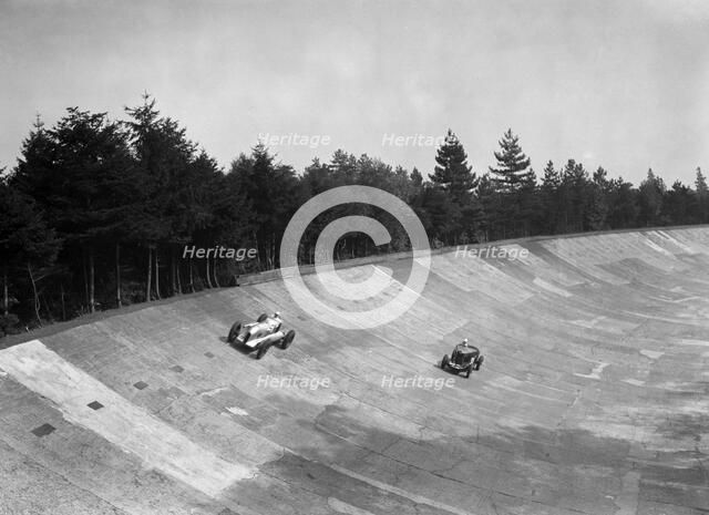 Oliver Bertram's Barnato-Hassan and GA Wooding's Talbot 95 Special, Brooklands, 1938. Artist: Bill Brunell.