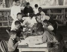 Oliver Harrington supervises class studying mural work, Hudson Ave Boys Club, 1936. Creator: Andrew Herman
