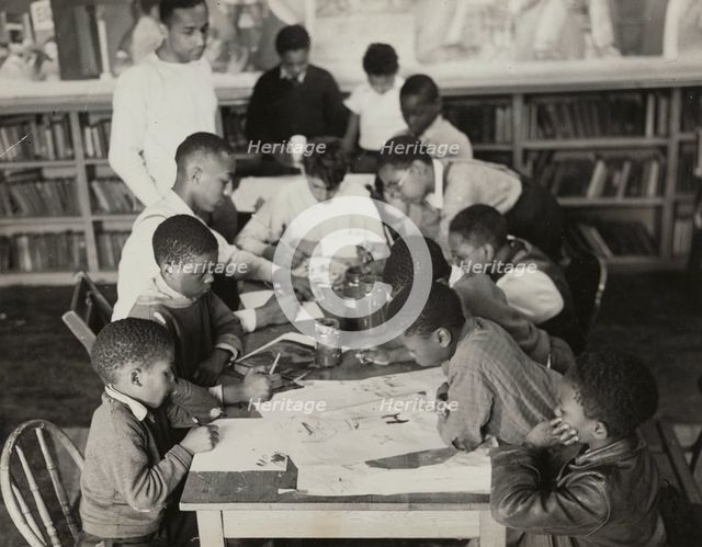 Oliver Harrington supervises class studying mural work, Hudson Ave Boys' Club, 1936. Creator: Andrew Herman.
