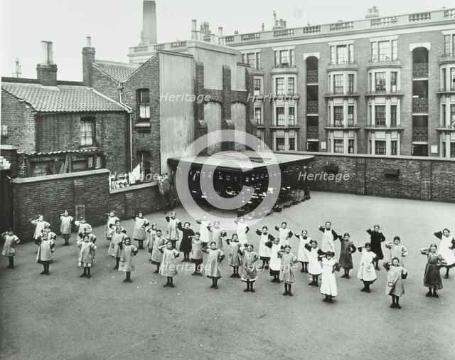Open air exercise class, Ben Jonson School, Stepney, London, 1911. Artist: Unknown.