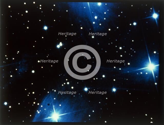 Open star cluster, the Pleiades in Taurus. Creator: NASA.