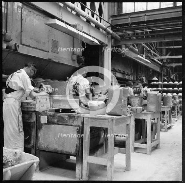 Operating jiggers in a pottery works, Stoke-on-Trent, 1965-1968. Creator: Eileen Deste.