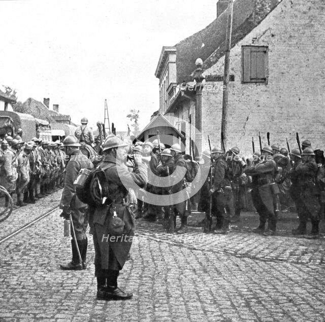 Operations in Flanders; Belgian troops pay honour to the flag of a French regiment..., 1917. Creator: Unknown.