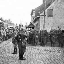 Operations in Flanders; Belgian troops pay honour to the flag of a French regiment..., 1917. Creator: Unknown