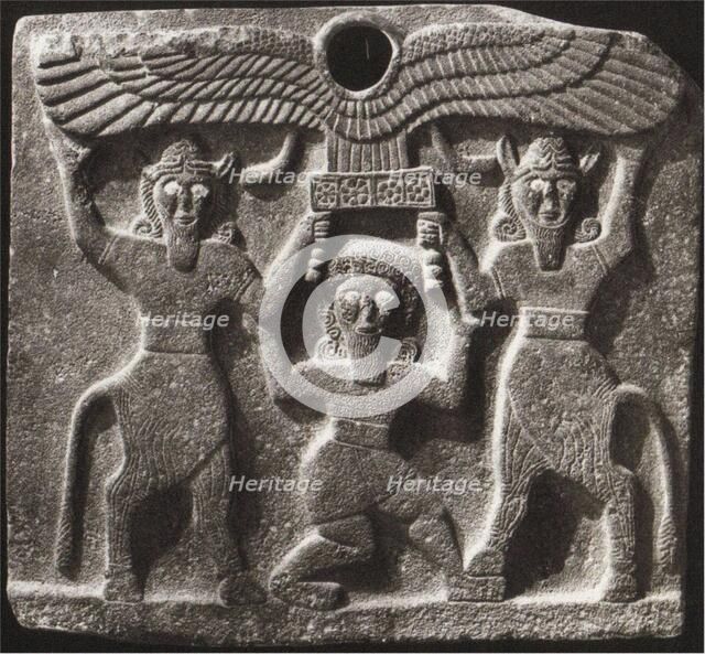 Orthostates depicting Gilgamesh between two minotaur demigods holding up the sun disc. From Tell Hal