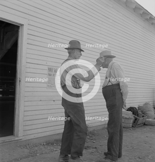 Oregon farmers, old settlers, at farmer's public sale, Saturday, Nyssa, Malheur County, Oregon, 1939 Creator: Dorothea Lange.