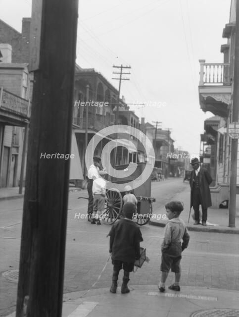 Organ grinder, New Orleans, between 1920 and 1926. Creator: Arnold Genthe.