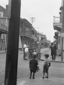 Organ grinder, New Orleans, between 1920 and 1926. Creator: Arnold Genthe