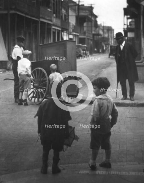 Organ grinder, New Orleans, between 1920 and 1926. Creator: Arnold Genthe.