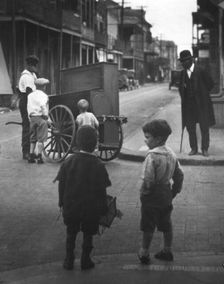 Organ grinder, New Orleans, between 1920 and 1926. Creator: Arnold Genthe