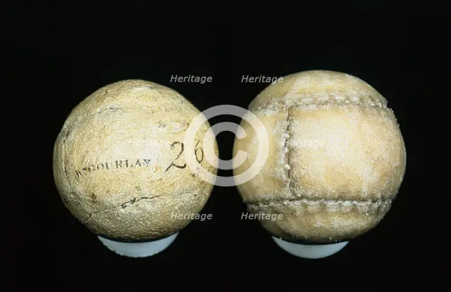 Original and reproduction of feathery golf balls, original c1830-c1840. Creator: William Gourlay.