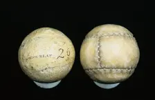 Original and reproduction of feathery golf balls, original c1830-c1840. Creator: William Gourlay