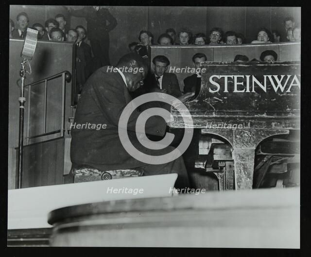 Oscar Peterson in concert at Colston Hall, Bristol, 1955. Artist: Denis Williams