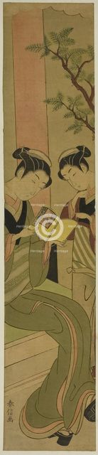 Osen of the Kagiya teahouse and an assistant reading a novelette, c. 1769/70. Creator: Suzuki Harunobu.