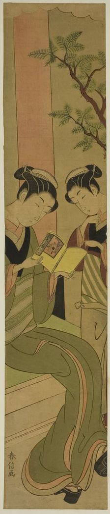 Osen of the Kagiya teahouse and an assistant reading a novelette, c. 1769/70. Creator: Suzuki Harunobu