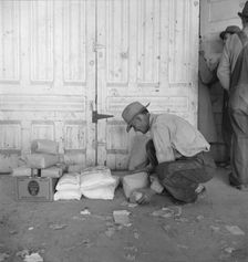 Outside the FSA grant office during pea harvest, Calipatria, California, 1939. Creator: Dorothea Lange