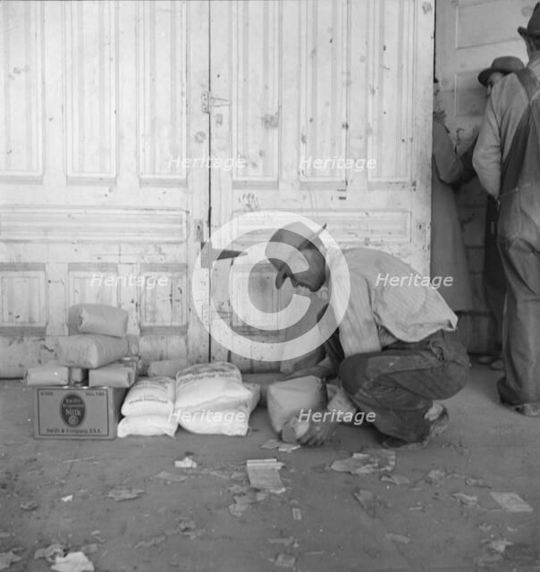 Outside the FSA grant office during pea harvest, Calipatria, California, 1939. Creator: Dorothea Lange.