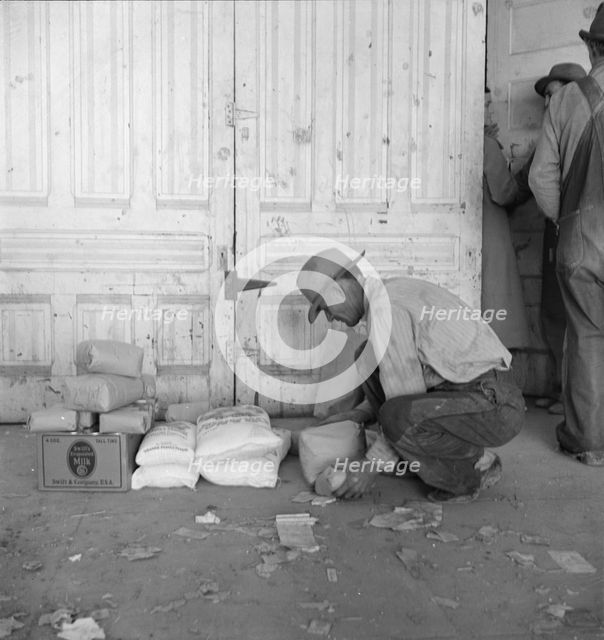 Outside the FSA grant office during pea harvest, Calipatria, California, 1939. Creator: Dorothea Lange.