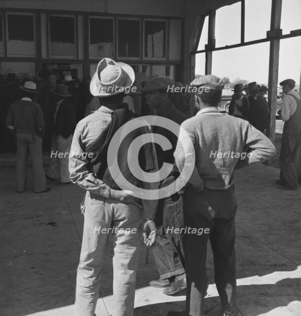 Outside the FSA grant office during the pea harvest, Calipatria, California, 1939. Creator: Dorothea Lange.