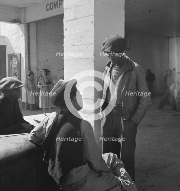 Outside the FSA grant office during the pea harvest, Calipatria, California  1939. Creator: Dorothea Lange.