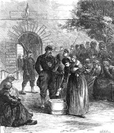 Outside the prison of La Roquette, Paris: letters for the prisoners, 1871. Creator: William Simpson