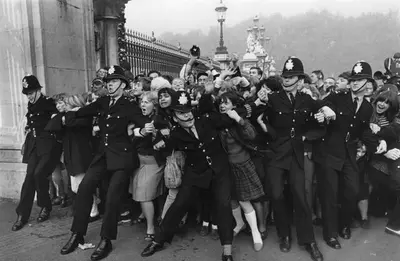 Outside Buckingham Palace when the Beatles received their MBEs, London, 26 October 1965. Creator: Unknown.