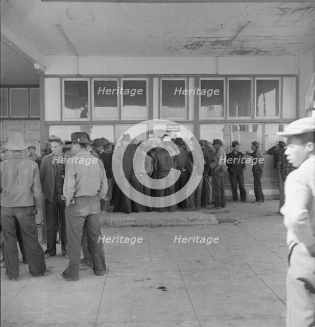 Outside FSA grant office during the pea harvest, Calipatria, California, 1939. Creator: Dorothea Lange.