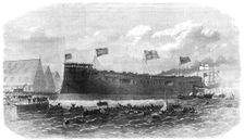 Our Iron-Clad Fleet: floating of Her Majesty's ship Hercules, at Chatham, 1868. Creator: Unknown