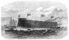 Our Iron-Clad Fleet: floating of Her Majesty's ship Hercules, at Chatham, 1868. Creator: Unknown