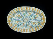 Oval dish, moulded in relief on the front with an oval central boss, 1649