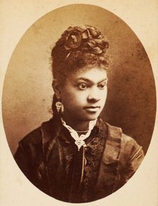 Oval quarter-length portrait of unidentified young woman, her bodice center trimmed..., c1870-c1879. Creators: Unknown, Moses Parker Rice
