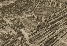 Over Olympia and the Headquarters of the Post Office Savings Bank c1935. Creator: Surrey Flying Services