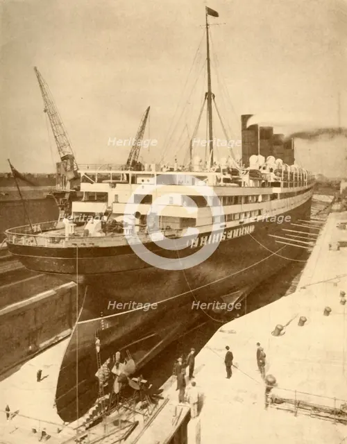 'Overhauling a Large Liner in a Graving Dock at Liverpool', c1930. Creator: Unknown.