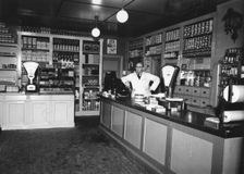 Owner Magnus Påhlsson in his grocer's shop, Sweden, 1943. Creator: Unknown