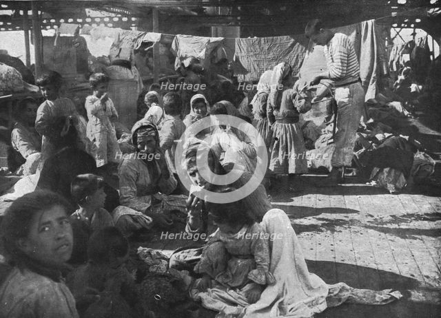 'L'aide Francaise aux Armeniens; Campes sur le pont du croiseur ou'ils avaient..., 1915 (1924). Creator: Unknown.
