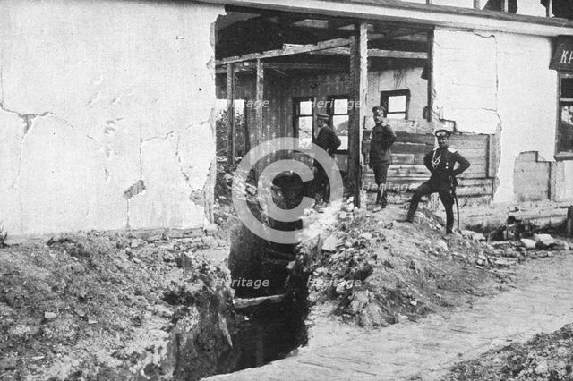 'L'offensive russe; une tranchee autrichienne dans une maison en ruines a Doubno..., 1916 (1924) Creator: Unknown.