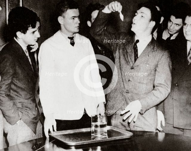 Lothrop Withington, Jr (right), a Harvard freshman, swallowing a goldfish, USA, 1935. Creator: Unknown.