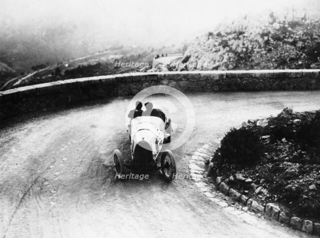 Louis Chiron driving a Bugatti at a hill climb, 1923. Artist: Unknown