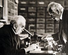 Louis and Auguste Lumière (1864-1948 and 1862-1954), French chemists and biologists in their labo…