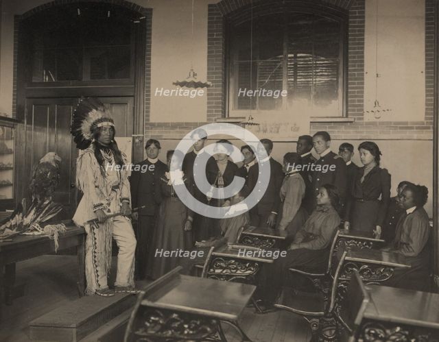 Louis Firetail (Sioux, Crow Creek), wearing tribal clothing, in American history..., 1899 or 1900. Creator: Frances Benjamin Johnston.